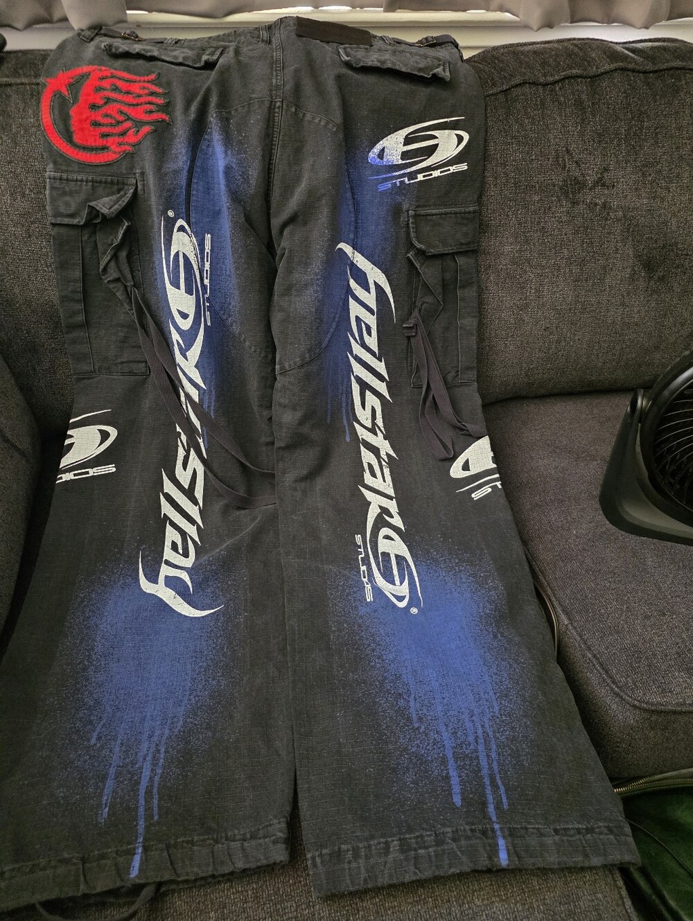 Hellstar Studios Black Graphic Cargo Pants with Blue Spray. SZ XL (40-44)